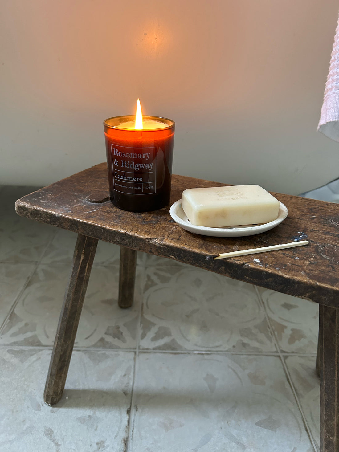 Our cashmere candle in amber jar in the bathroom